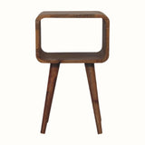 A small natural finish Hamade bedside table with four legs, an open slot compartment, and no visible storage shelves.