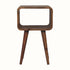 A small natural finish Hamade bedside table with four legs, an open slot compartment, and no visible storage shelves.