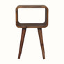 A small natural finish Hamade bedside table with four legs, an open slot compartment, and no visible storage shelves.