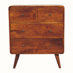 A Scandinavian-style chest of drawers made of solid mango wood with a chestnut finish, featuring four drawers with brass knobs and a visible record player surface.