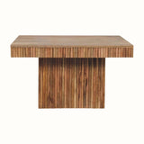 A rectangular coffee table made of solid mango wood with a natural finish and grooved lines carved on the surface.
