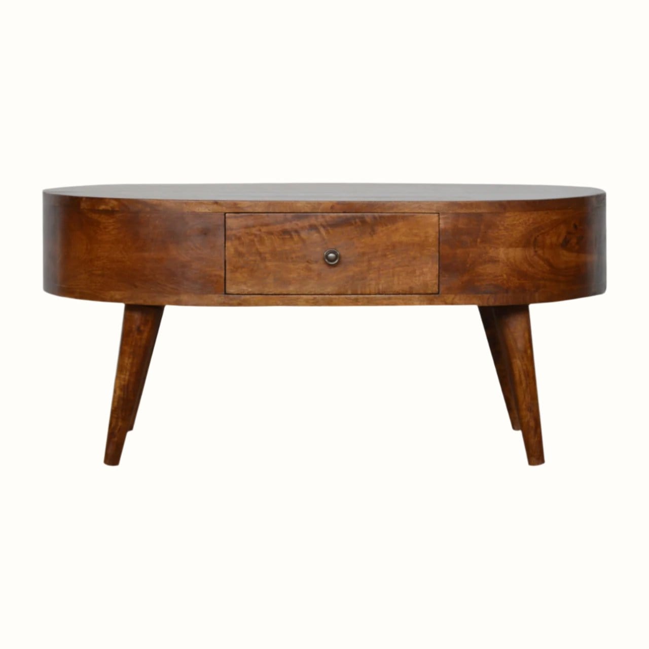 A round, chestnut finish mango wood coffee table with four tapered legs and two drawers with brass knob hardware.