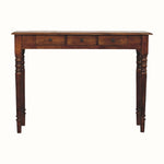 Wooden console table with three drawers on a white background