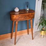 A small console table with a chestnut finish, featuring a rectangular tabletop and tapered legs, with a single drawer on the front.