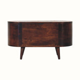 A light walnut-colored storage box with a lift-up lid, featuring curved lines and resting on short, sturdy legs.